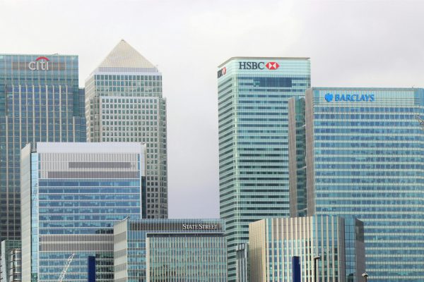 Modern skyline of Canary Wharf featuring iconic bank skyscrapers like HSBC and Barclays.